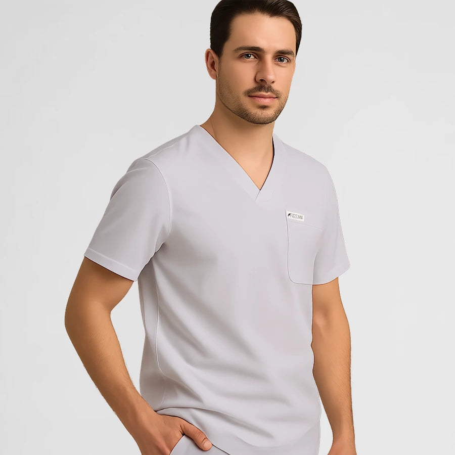 Photo de Pyjama de Bloc Homme - Col V Stretch – confort, broderie et style professionnel. FIGS.ma | Scrubs Maroc.